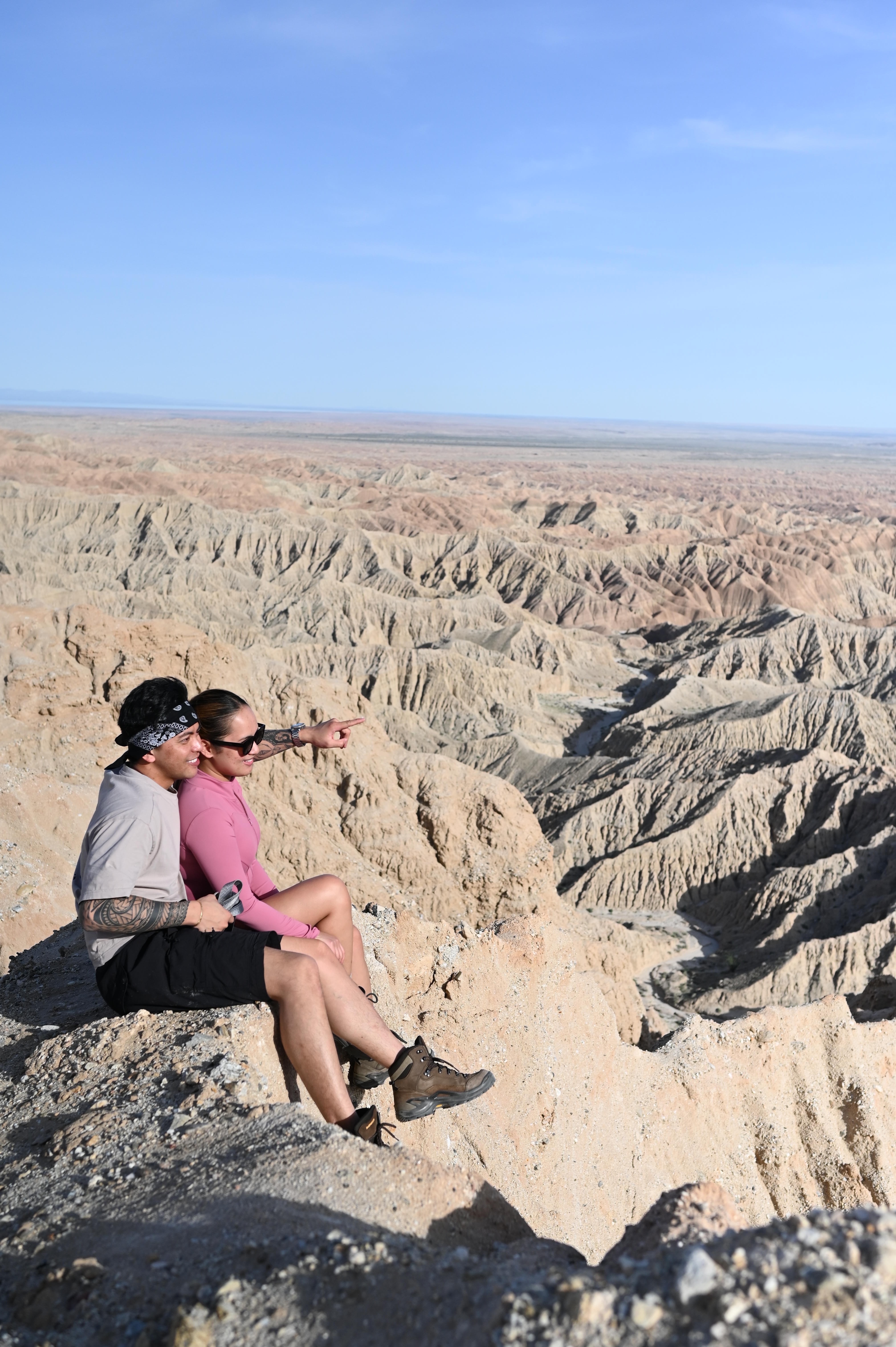 A couple laughing together on a desert overlook